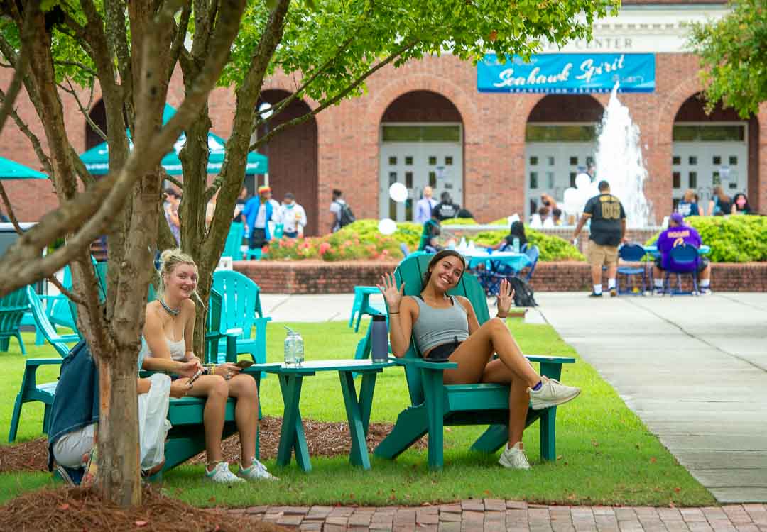 Joyful students having a wonderful time at the beautiful campus