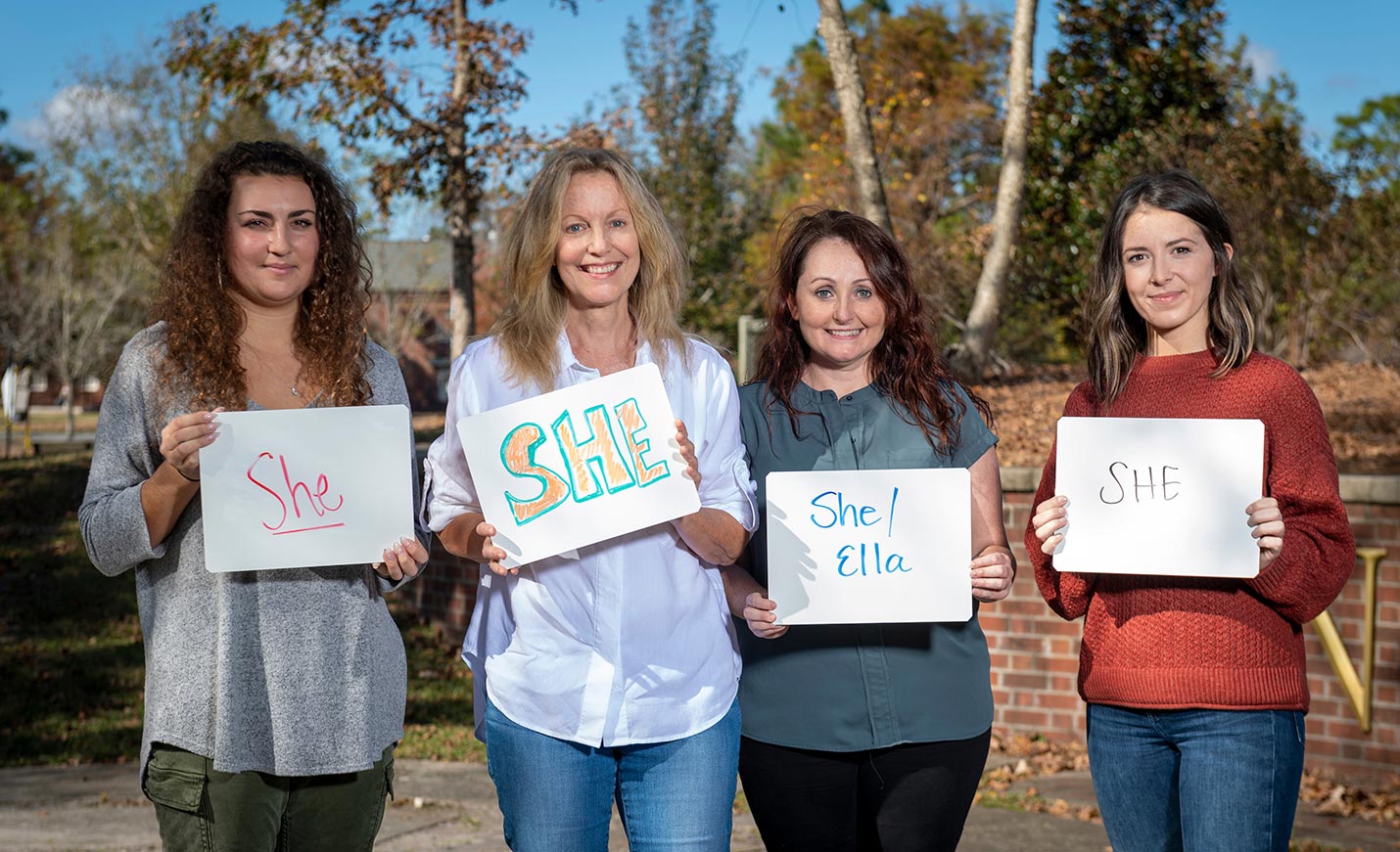 Women holding signs